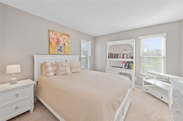 bedroom with light carpet