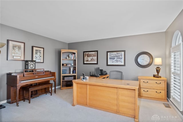 office with light colored carpet, baseboards, and visible vents