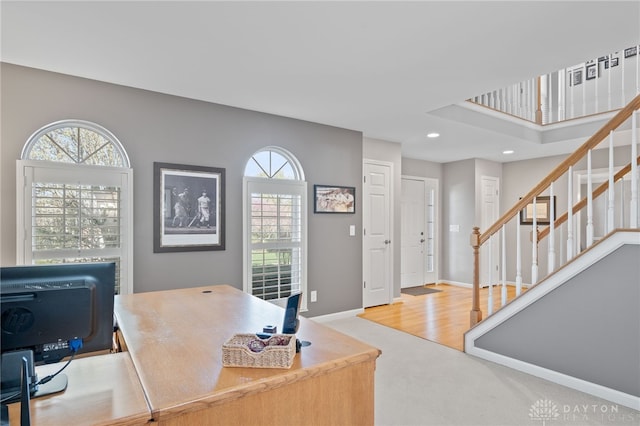 carpeted home office with recessed lighting, plenty of natural light, and baseboards