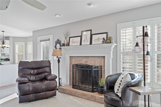 living room with recessed lighting and a brick fireplace