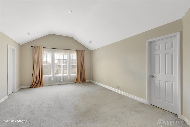 1490 Dell Glen Rd, Dayton, OH 45458 - empty room with light colored carpet, baseboards, and vaulted ceiling