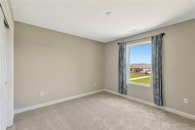 1490 Dell Glen Rd, Dayton, OH 45458 - empty room featuring light carpet and baseboards