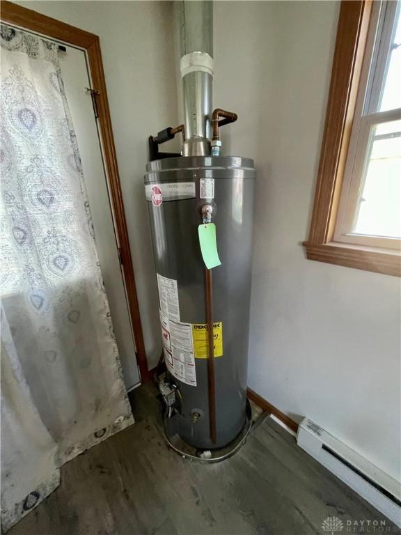 127 S Main St, Lewisburg, OH 45338 - utility room featuring water heater and baseboard heating