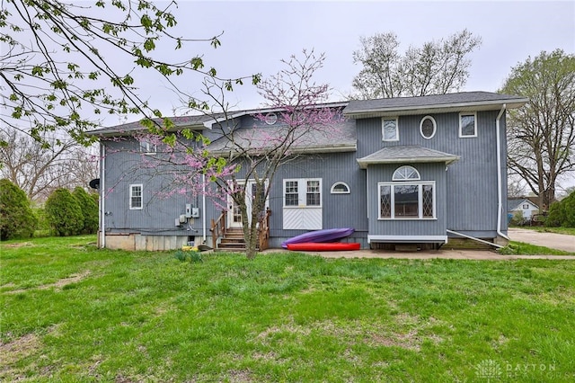 back of house with a yard