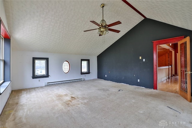 unfurnished living room featuring carpet, a textured ceiling, a ceiling fan, vaulted ceiling, and baseboard heating