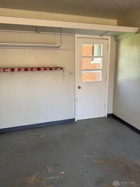 garage featuring baseboards