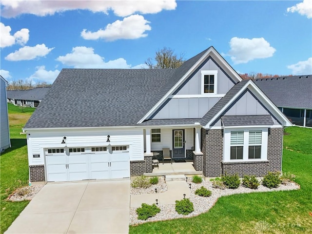 1110 Billingsley Dr, Batavia, OH 45103 - view of front of home featuring board and batten siding, covered porch, brick siding, an attached garage, and concrete driveway