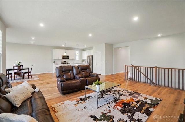 1110 Billingsley Dr, Batavia, OH 45103 - living room with light wood-style floors, baseboards, and recessed lighting