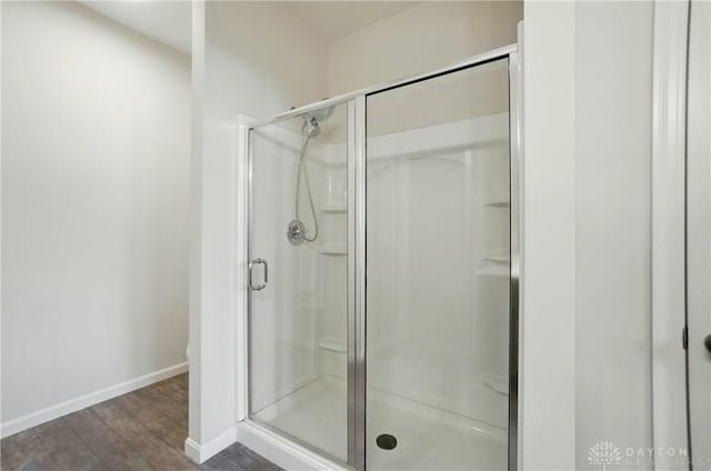 1110 Billingsley Dr, Batavia, OH 45103 - bathroom featuring a shower stall, wood finished floors, and baseboards