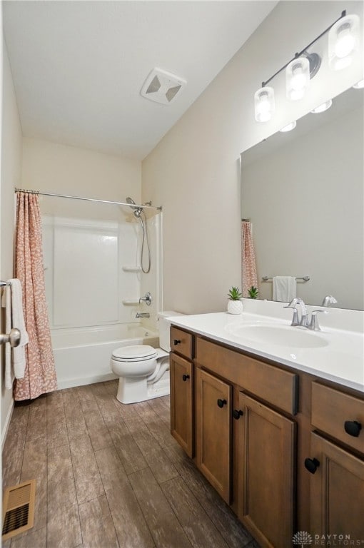 1110 Billingsley Dr, Batavia, OH 45103 - full bathroom featuring shower / washtub combination, vanity, visible vents, toilet, and wood finished floors
