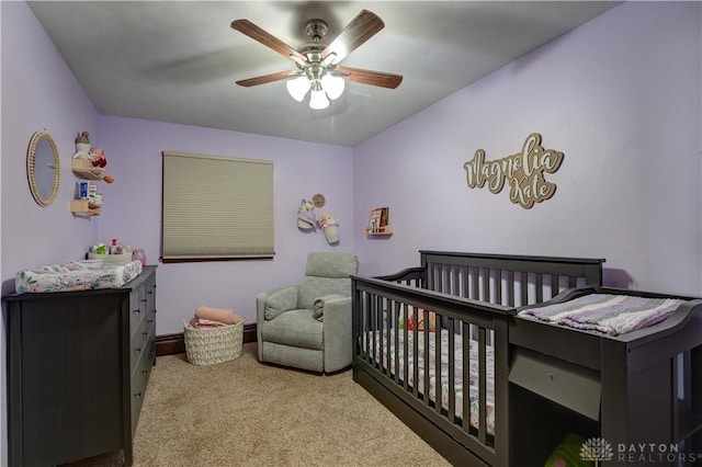 carpeted bedroom with a ceiling fan
