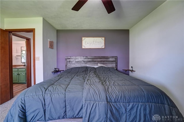 bedroom featuring a sink and ceiling fan