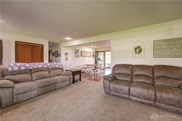 living room with recessed lighting and carpet flooring