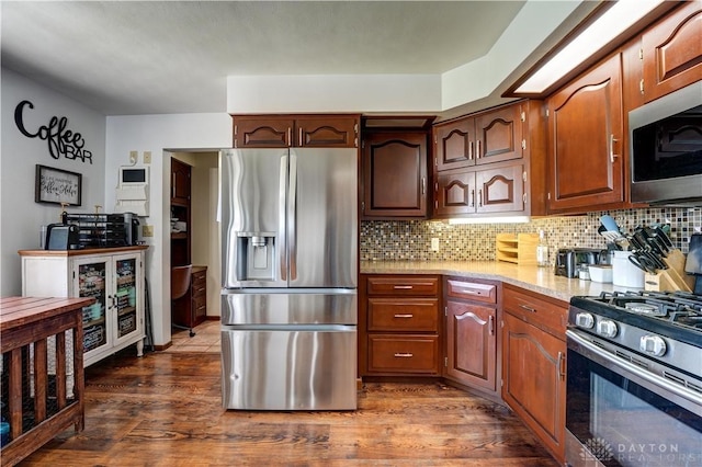 kitchen featuring wine cooler, appliances with stainless steel finishes, decorative backsplash, and dark wood-style floors