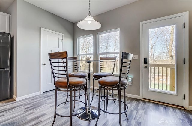 1629 Arden Bnd, Fairborn, OH 45324 - dining area featuring light wood-style floors and baseboards