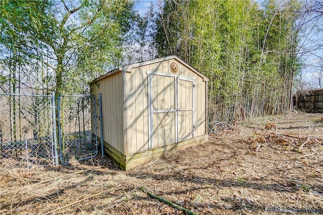 view of shed with fence