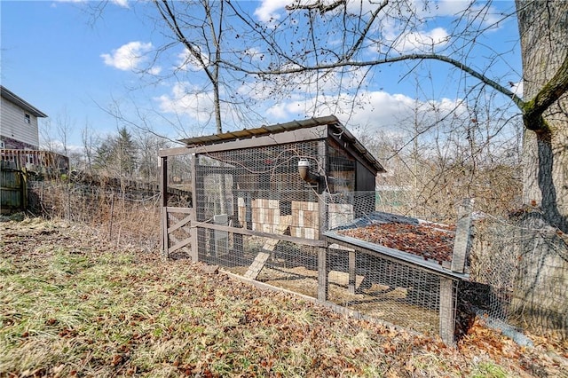 view of poultry coop with fence