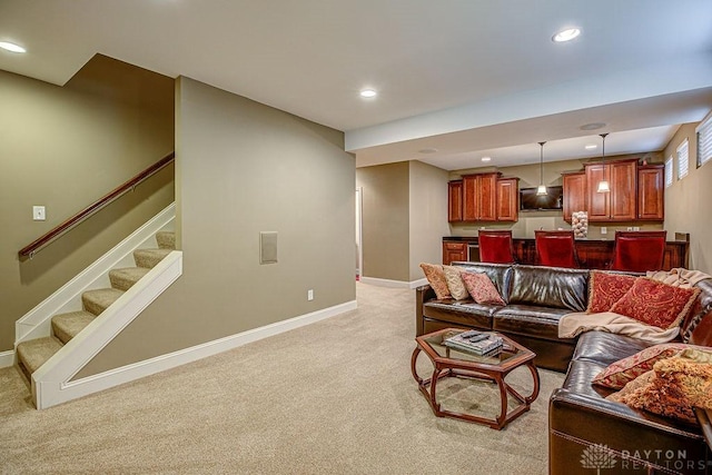 living room featuring light carpet, recessed lighting, stairway, and baseboards