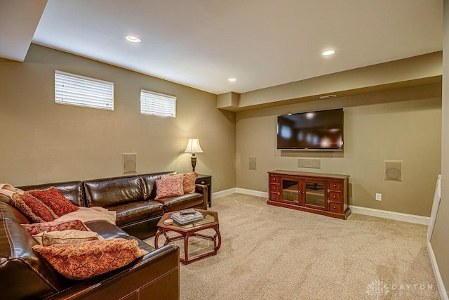 living room featuring baseboards, recessed lighting, and light colored carpet