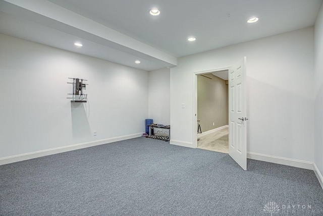 finished below grade area with carpet floors, baseboards, and recessed lighting