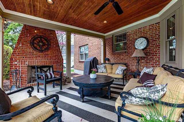 view of patio featuring an outdoor living space with a fireplace, a ceiling fan, and grilling area