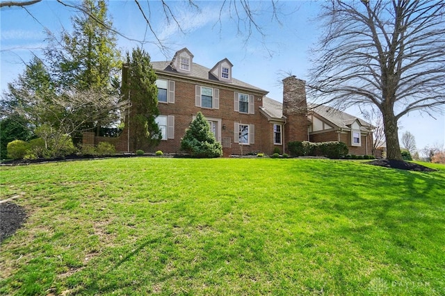 1458 Westwicke Pl, Washington Twp, OH 45459 - view of front of house with a front yard and brick siding