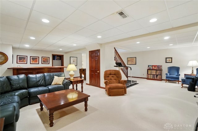 1458 Westwicke Pl, Washington Twp, OH 45459 - carpeted living room with baseboards, recessed lighting, stairs, visible vents, and a drop ceiling