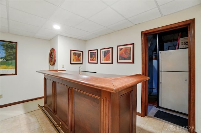 1458 Westwicke Pl, Washington Twp, OH 45459 - bar with baseboards, a drop ceiling, and freestanding refrigerator