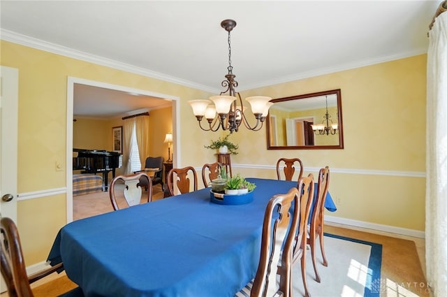 1458 Westwicke Pl, Washington Twp, OH 45459 - dining space featuring crown molding, baseboards, and a notable chandelier