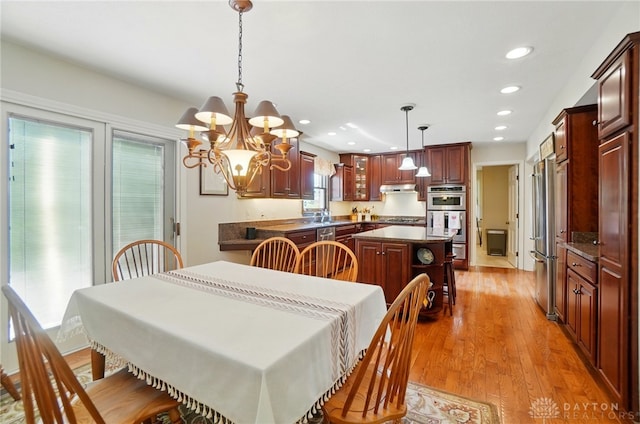 1458 Westwicke Pl, Washington Twp, OH 45459 - dining area featuring recessed lighting, light wood-style flooring, and an inviting chandelier