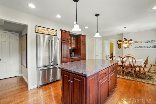 1458 Westwicke Pl, Washington Twp, OH 45459 - kitchen featuring high end refrigerator, light wood finished floors, hanging light fixtures, and a notable chandelier