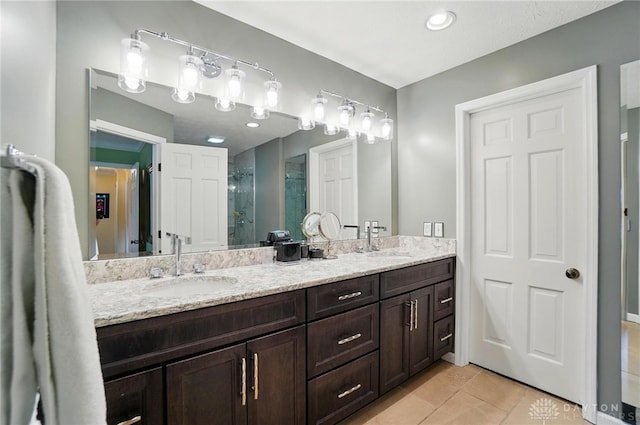 1458 Westwicke Pl, Washington Twp, OH 45459 - bathroom with tile patterned floors, double vanity, a sink, and a stall shower