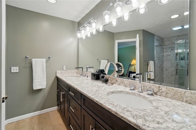 1458 Westwicke Pl, Washington Twp, OH 45459 - full bathroom with double vanity, baseboards, a sink, and a marble finish shower