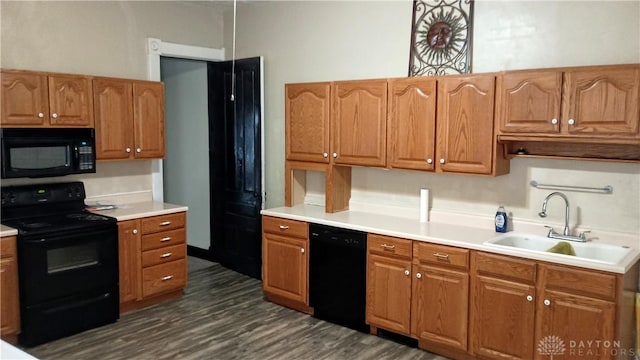 229-227 James St Unit 2, Dayton, OH 45410 - kitchen with black appliances, dark wood finished floors, light countertops, and brown cabinetry