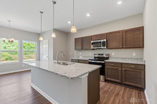 1226 Heathgate Way, Fairborn, OH 45324 - kitchen with stainless steel appliances, dark wood-type flooring, an island with sink, decorative light fixtures, and recessed lighting