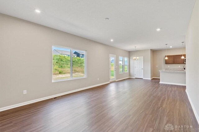 1226 Heathgate Way, Fairborn, OH 45324 - unfurnished living room featuring a chandelier, dark wood-style floors, and recessed lighting