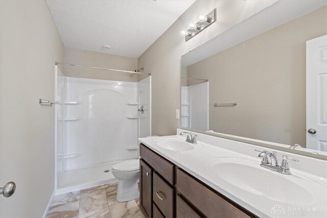 1226 Heathgate Way, Fairborn, OH 45324 - bathroom featuring marble look tiles, double vanity, and a shower