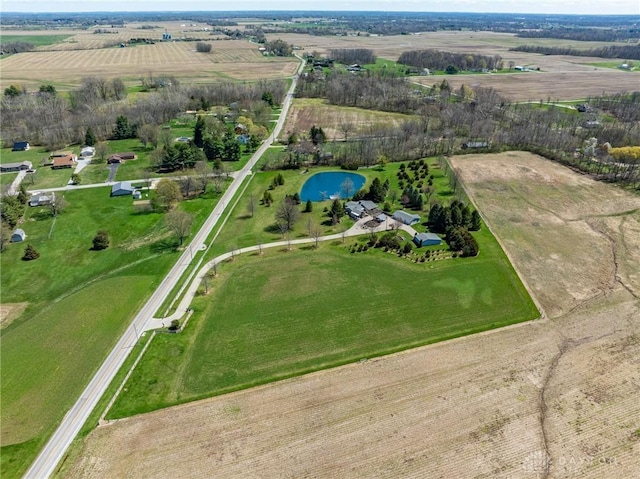 drone / aerial view featuring a water view and a rural view