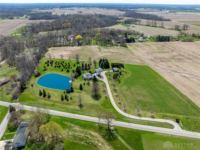 birds eye view of property with a water view and a rural view