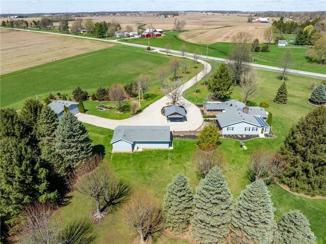 birds eye view of property with a rural view