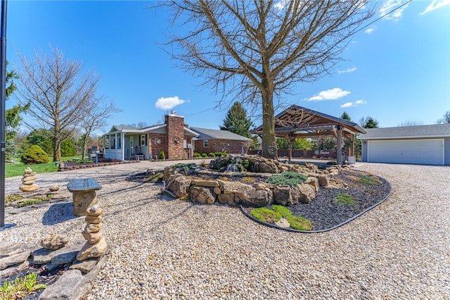 ranch-style home with a gazebo and a garage