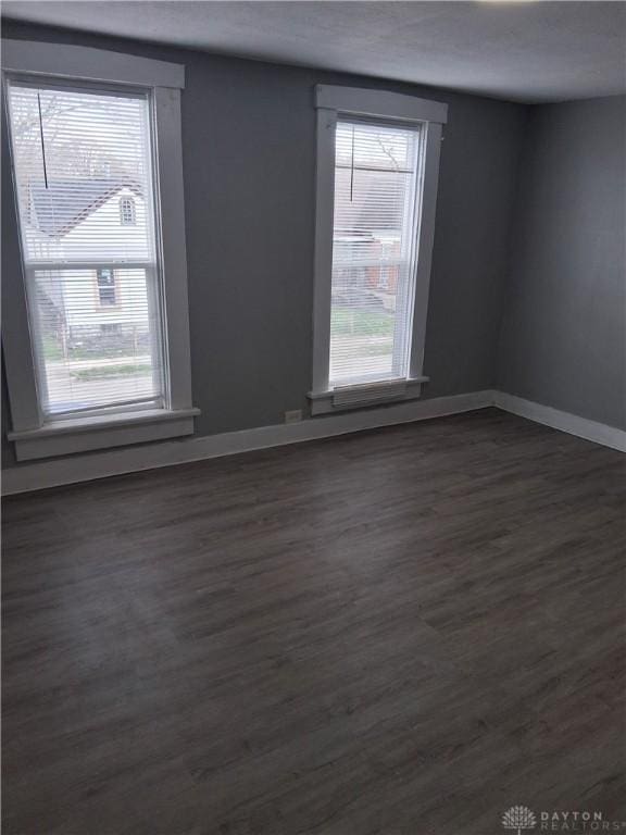 217 Fillmore St, Dayton, OH 45410 - spare room with baseboards and dark wood finished floors