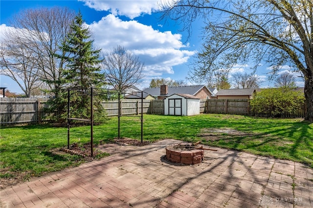 1917 Beckert Dr, Piqua, OH 45356 - view of patio featuring an outdoor fire pit