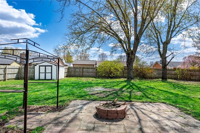 1917 Beckert Dr, Piqua, OH 45356 - view of patio with an outdoor fire pit