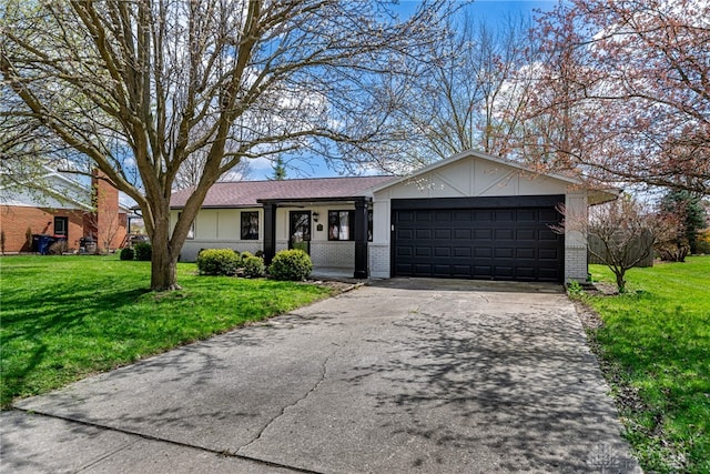 1917 Beckert Dr, Piqua, OH 45356 - single story home featuring a garage, asphalt driveway, brick siding, and a front lawn