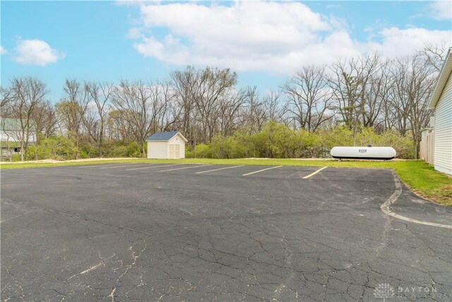 7045 US-40, New Carlisle, OH 45344 - uncovered parking lot with a shed