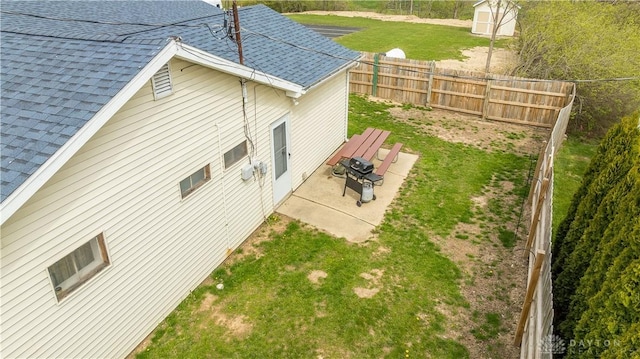 7045 US-40, New Carlisle, OH 45344 - view of side of property featuring roof with shingles and a patio