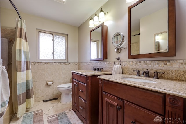 full bath featuring visible vents, toilet, tile walls, vanity, and tile patterned floors