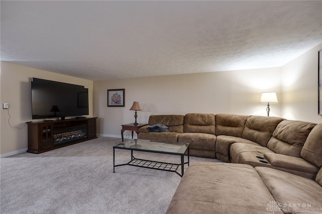 carpeted living room with baseboards