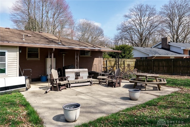 view of patio featuring fence